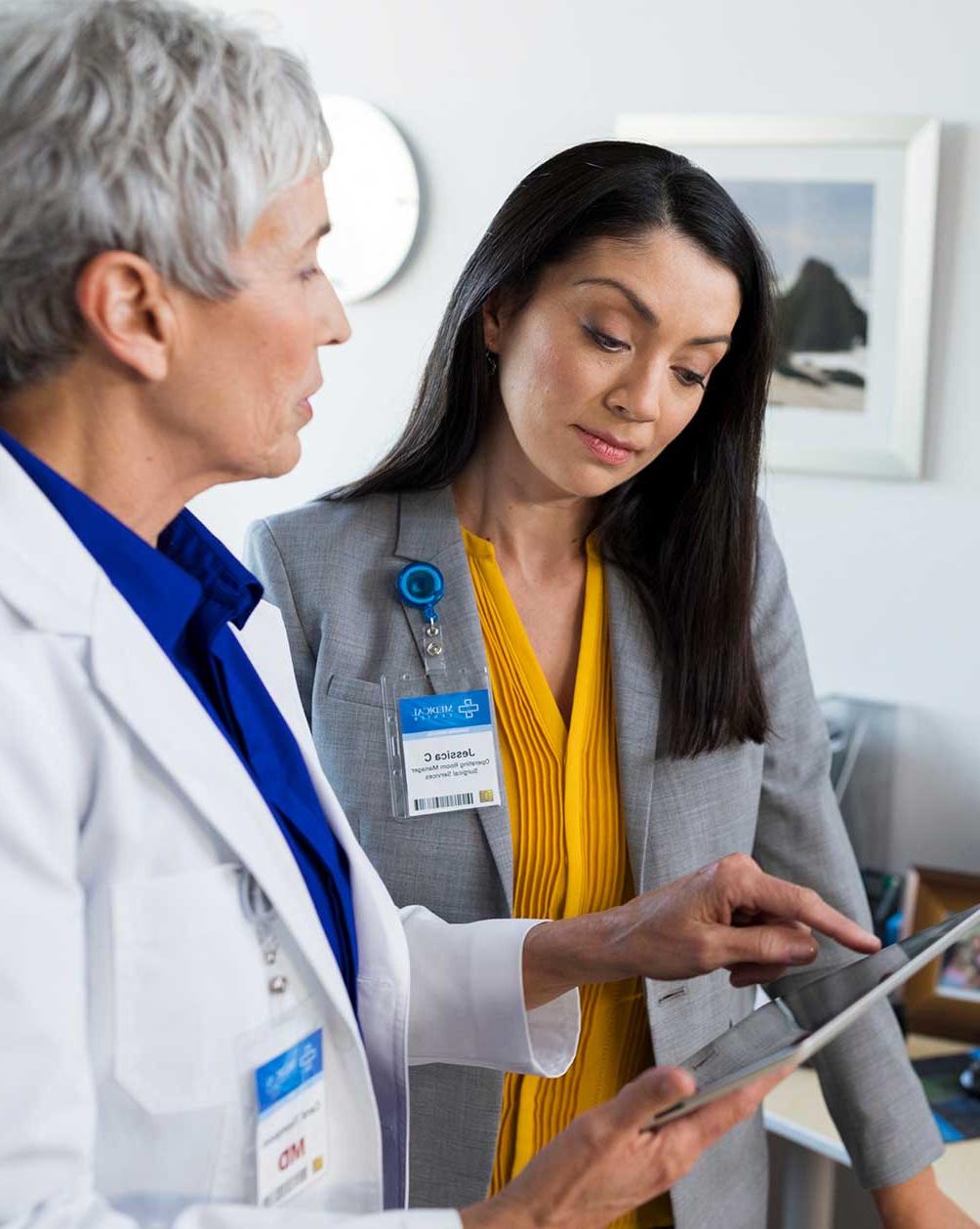 Health administrator and nurse going over paperwork